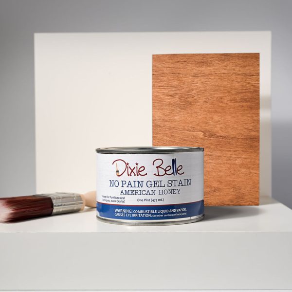 8 oz bottle of Dixie Belle No Pain Gel Stain in American Honey, a warm golden brown wood stain with rich honey undertones, water-based and fast-drying for furniture and home décor projects.