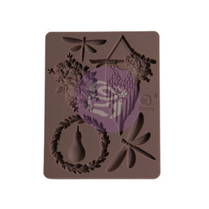 Create unique and beautiful embellishments with the Aquarelle Dreams silicone mould, designed by The 3 Girls Tale. Multiple stunning designs – a macrame creation, wreath, lightbulb, floral cluster, and dragonflies – are all included in this 3.5″ x 4.5″ mould. Use resin, modeling clay, hot glue, melting chocolate (yes, the mould is food safe), fondant and any other medium to cast your own embellishments or edible candies.