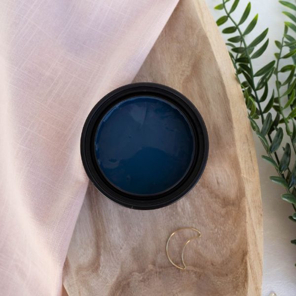 Dixie Belle Terra Clay Paint in Blue Moon, a deep night-sky blue clay paint, perfect for furniture, walls, and creative DIY projects.