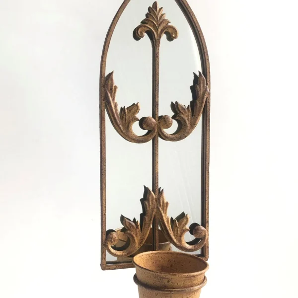 Rustic garden wall mirror with integrated wooden planter box, featuring a weathered vintage frame and filled with blooming flowers, mounted on an outdoor brick wall.